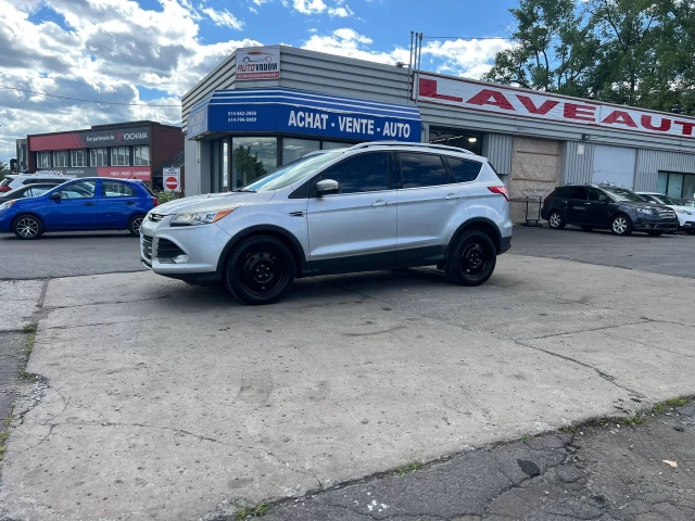 Ford Escape Titanium**SAAQ CERTIFIEE**AWD**Toit Ouvrant Panaromique**ANGLE MORT**Caméra de Recul**SIEGES EN CUIR**Navigation**SIEGES CHAUFFANTS**démarrage à distance**MAGS** 2016